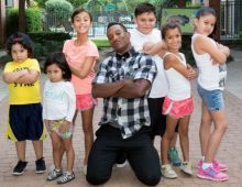 man posing with children