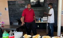 Picture of Two Men Making Meals in Large Kitchen