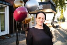 Tina Rogert in front of the HopeWorks Renew furniture store