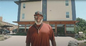 Hassan Latif, founder and executive director of Second Chance Center, in front of one of the organization's Colorado properties