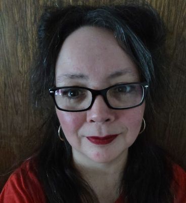 Woman in red blouse and wearing eyeglasses