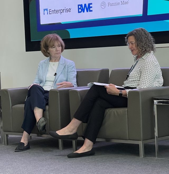 Two women in chairs talking