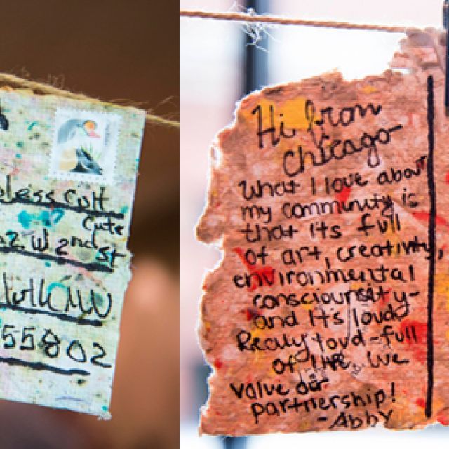 two postcards hanging on a clothesline