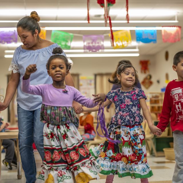 elementary classroom with teacher and dancing children