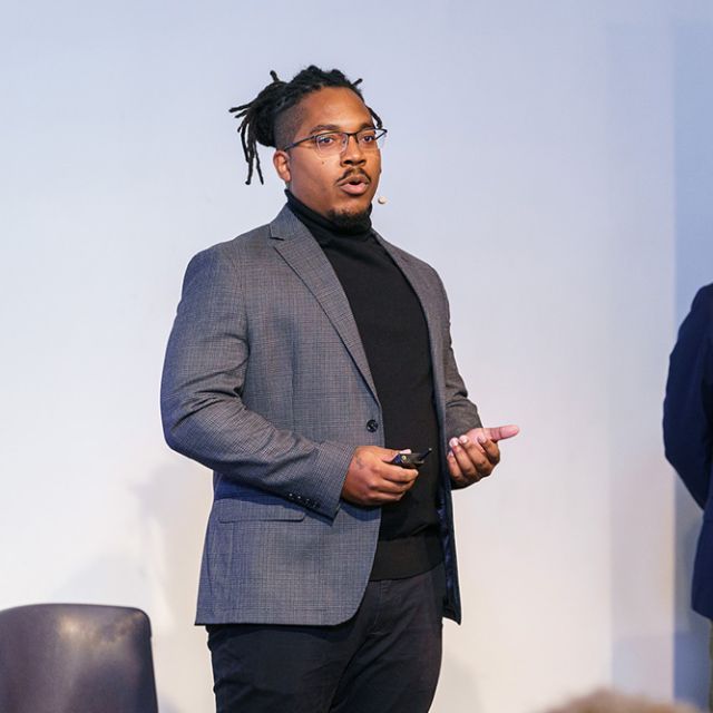 Two men standing and presenting