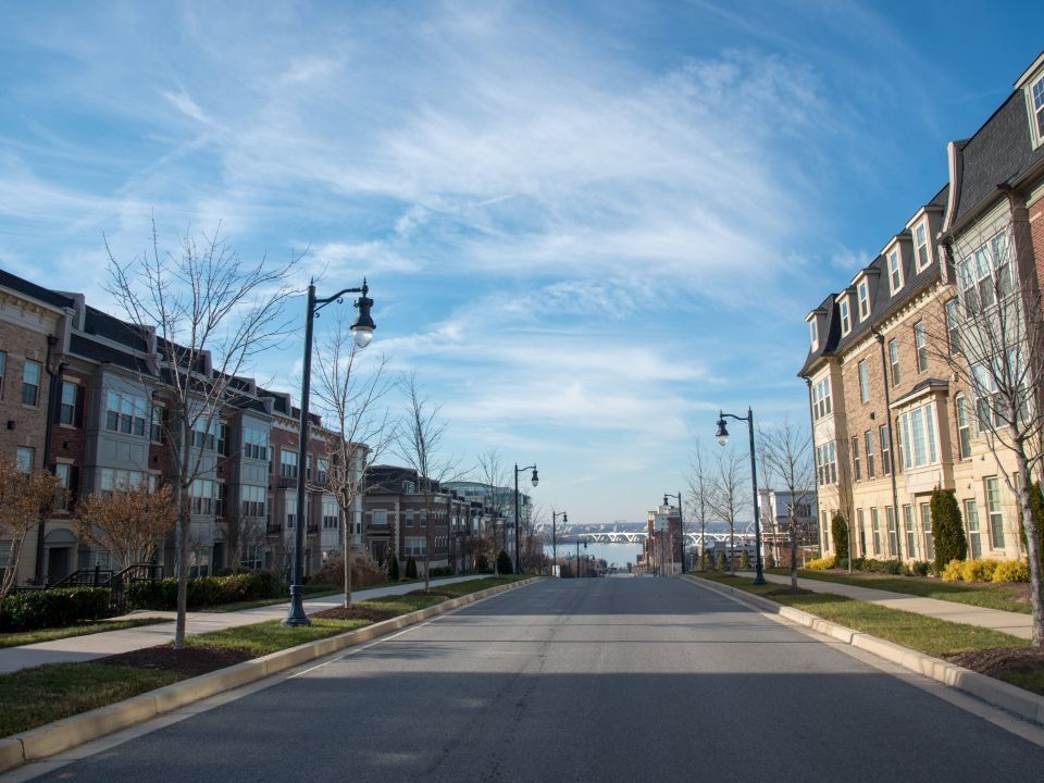 A neighborhood block with a blue sky in the background